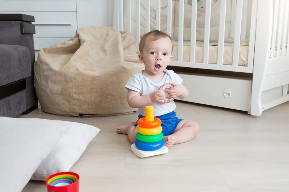 baby playing with ring toy