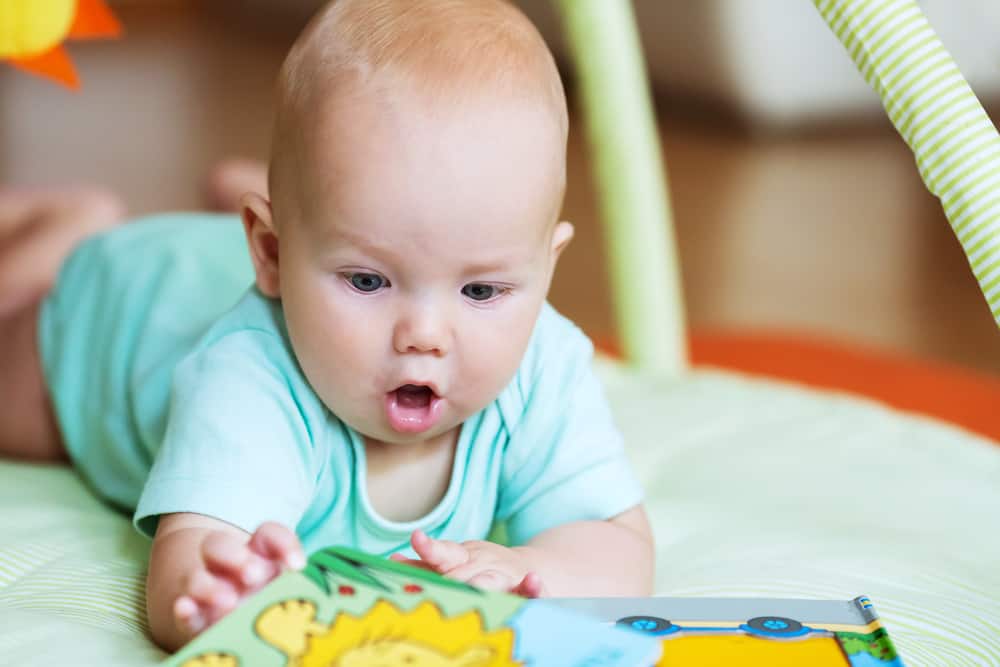 Baby playing with colorful toys